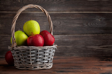 Colorful ripe apple fruits in basket