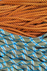 Rope for mountaineering and rock climbing orange and blue close-up