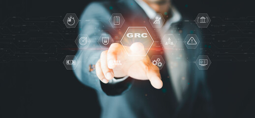 Businessmen experienced corporate is activating GRC onscreen. Business concept and information...