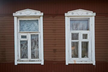 Windows of an old wooden house. Slavic or Balkan culture.