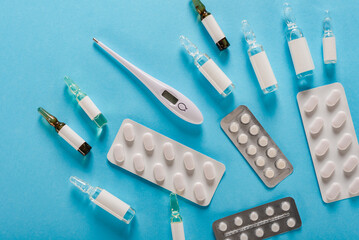 Virus prevention medical kit: electronic thermometer, pills and ampoules with vaccine