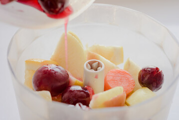 Fresh fruit and vegetables in mixer for natural organic smoothie