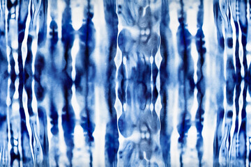 Abstract tie dyed fabric of indigo color. Shibori dyeing. Generative Ai.