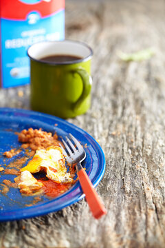 Close-up of leftovers in plate on wooden table