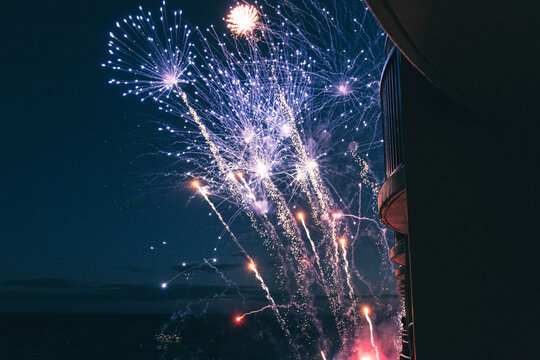 Low angle view of firework display in sky at night