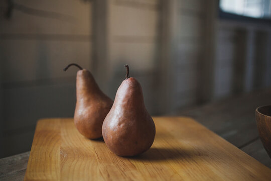 Close-up of pears on cutting board