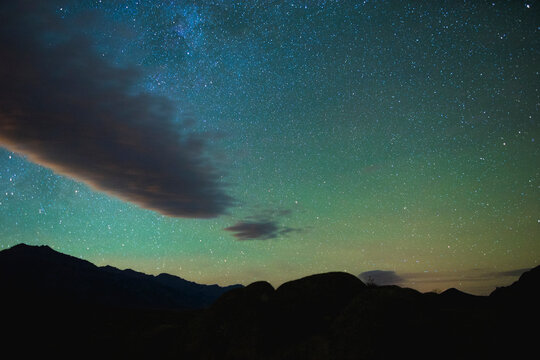Scenic view of silhouette mountain against star field at night