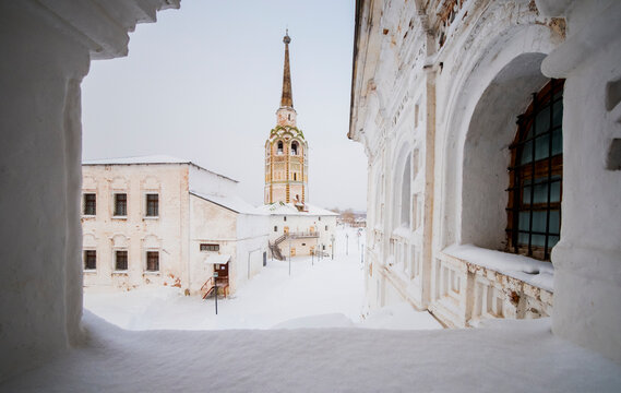 Church against sky seen through window during winter