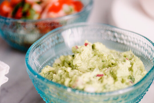 High angle close-up of green chutney in bowl on table