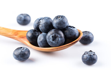 Fresh blueberries in wooden spoon