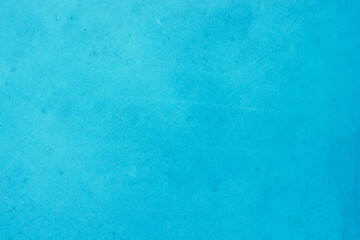 Blue concrete stone texture for background in summer wallpaper. Cement and sand wall of tone vintage. Concrete abstract wall of light cyan color.	
