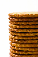 closeup of round crispy biscuits on white background.