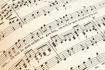 Closeup of the St Matthew Passion by Johann Sebastian Bach. Fragment of a tenor partition with text Ich will Jesum selbst begraben - obrazy, fototapety, plakaty