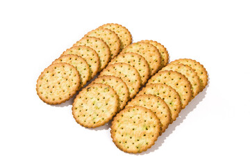 Heap of round thin crispy biscuits isolated on white background.