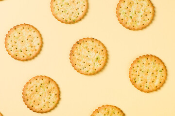 Group of tasty crackers or biscuit on yellow background.