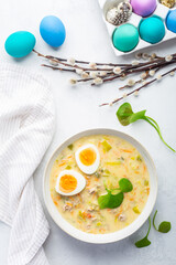 Traditional Polish sour soup Zurek in ceramic bowl  for Easter