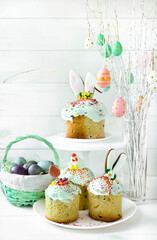 Basket with painted eggs. Easter tree with eggs. Traditional Christian Easter pastries. Minimal Easter composition with place for text. Happy Easter concept