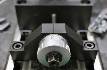 Close up of a linear positioning wheel mounted on rails