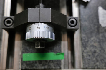 Close up of a linear positioning wheel mounted on rails