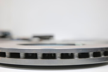 slice of a ventilated brake disc on a white background