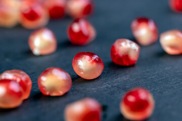 peeled red ripe pomegranate with juicy grains