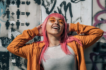 happy  anime urban woman vintage glasses and pink hair on graffiti wall
