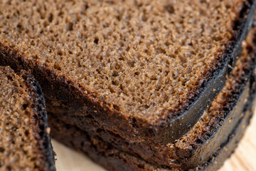 Square loaf of black rye bread Cut into pieces