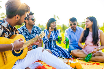 indian students having a lunch in Delhi park outdoors