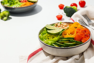 Bowls with tasty and nutritious food, space for text