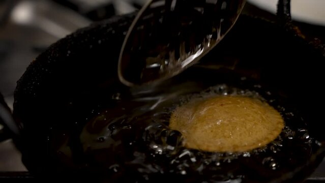 Floating Fresh Guror Handesh In Hot Oil. Slow Motion
