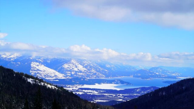 coeur dalene lake Schweitzer ski resort winter bluebird clouds mountain scape view Timelapse February 2019