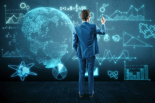 Back view of thoughtful young european businessman using glowing mathematical formulas and globe hologram on blurry blue background. Equation, digital data and mathematics app concept.