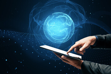Close up of hand pointing at mobile phone with polygonal globe hologram on dark background. World map with global social network. Future concept. Blue futuristic background with planet.