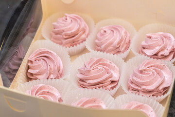 handmade fruit marshmallows in paper packaging on the table. home bakery concept.