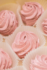 handmade fruit marshmallows in paper packaging on the table. home bakery concept.