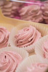 handmade fruit marshmallows in paper packaging on the table. home bakery concept.