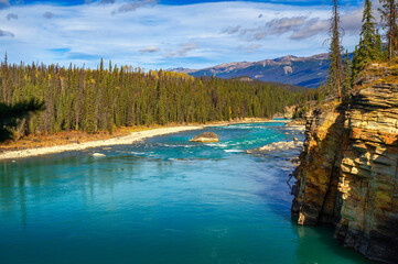 Turquoise water of Athabasca River in Jasper National Park, Alberta, Canada