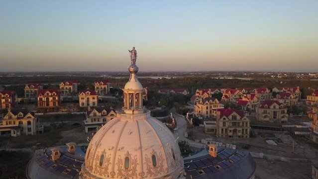 Drone pilot stands on dome of abandoned building near Shanghai, China