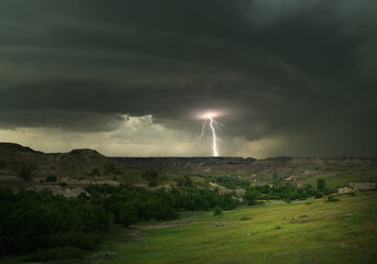 Lightning and thunderstorm over a valley. 