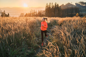 Woman running outdoors in the country forest. Healthy lifestyle concept, people go in sports....