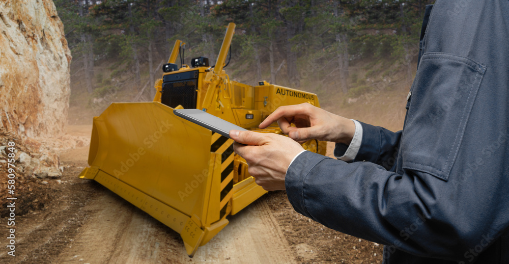 Aufkleber engineer programs autonomous bulldozer using digital tablet
