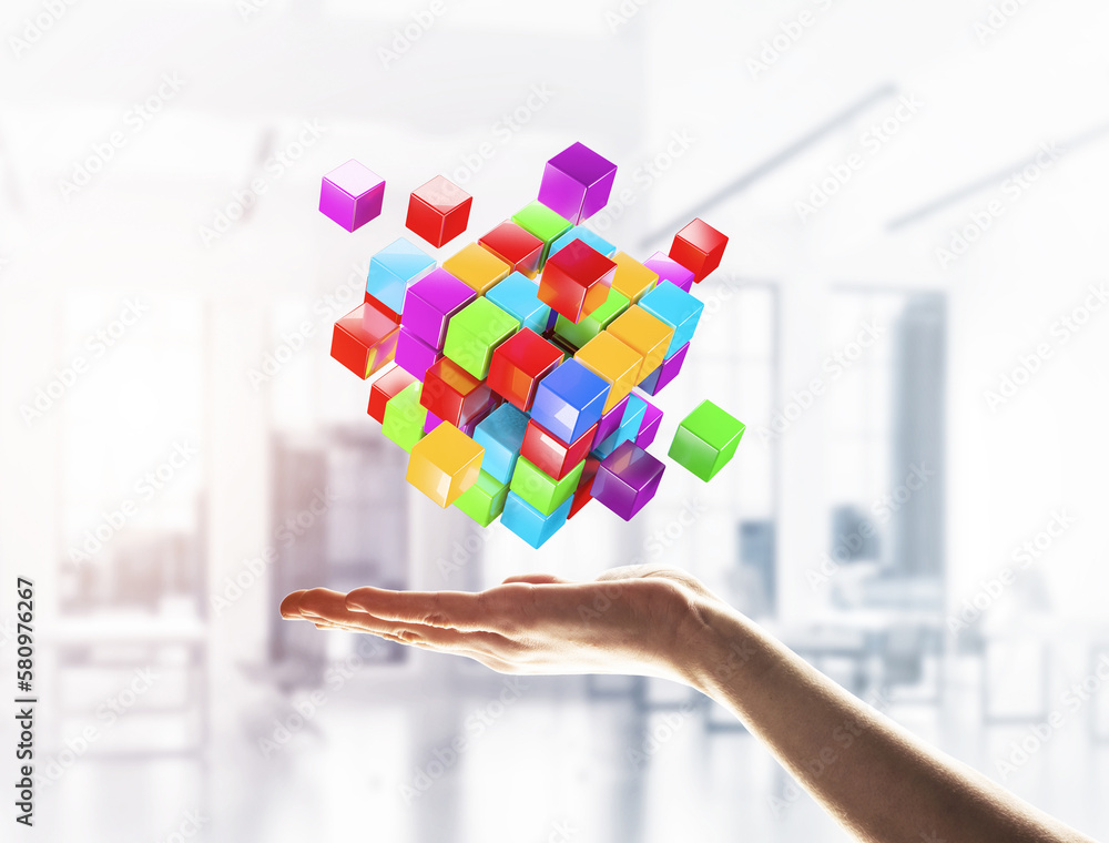Poster cube color figure in male palm as symbol for integration. 3d rendering