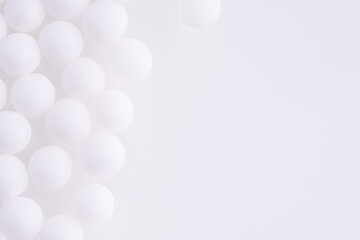 White balls on a white background. Background with white balls.