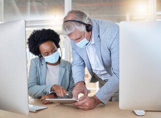 Covid, crm and employees with tablet, mask and senior man helping black woman at call center help desk. Compliance, consulting and opinion, crm data for medical advisory agency with coaching support.