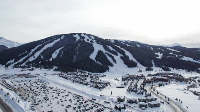 Drone aerial views of Copper Mountain, CO in the winter covered in snow