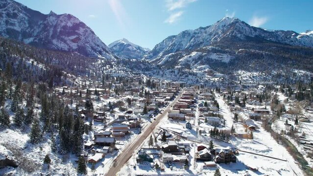 High drone aerial view of Ouray, Colorado on a sunny winter day