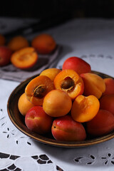 Fresh ripe apricots in bowl in rustic style