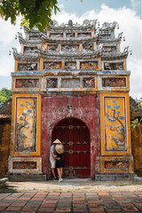 Fototapeta na wymiar Backpacker couple enjoy trip through southeast Asia in imperial city of Hue, Vietnam