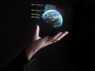 Hand, globe and hologram overlay with a user of ai or 3d technology accessing the metaverse for...