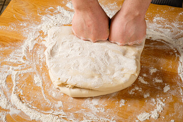 chef making pizza on the table